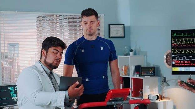 Man taking a stress test on a treadmill